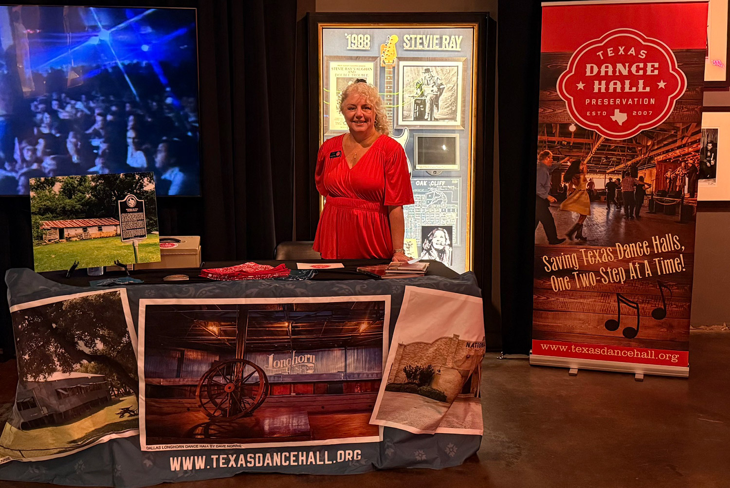 TDHP Board member in front of an event table